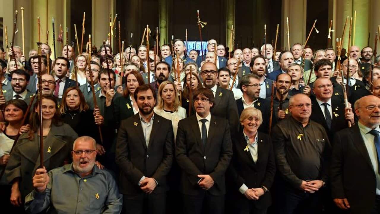 Carles Puigdemont, centre, poses with Catalan mayors