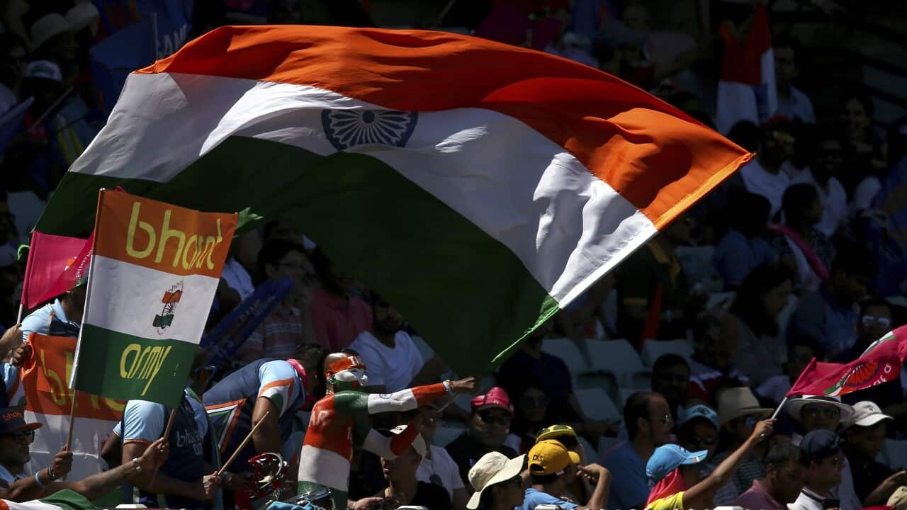 Indian cricket fans wave flags on day 2 the cricket test match between India and Australia in Sydney, Friday, Jan. 4, 2019.