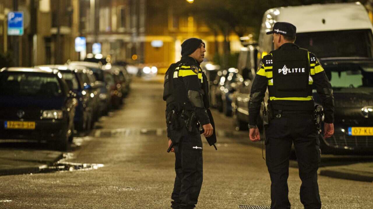 Police stand guard in Rotterdam-West, The Netherlands.