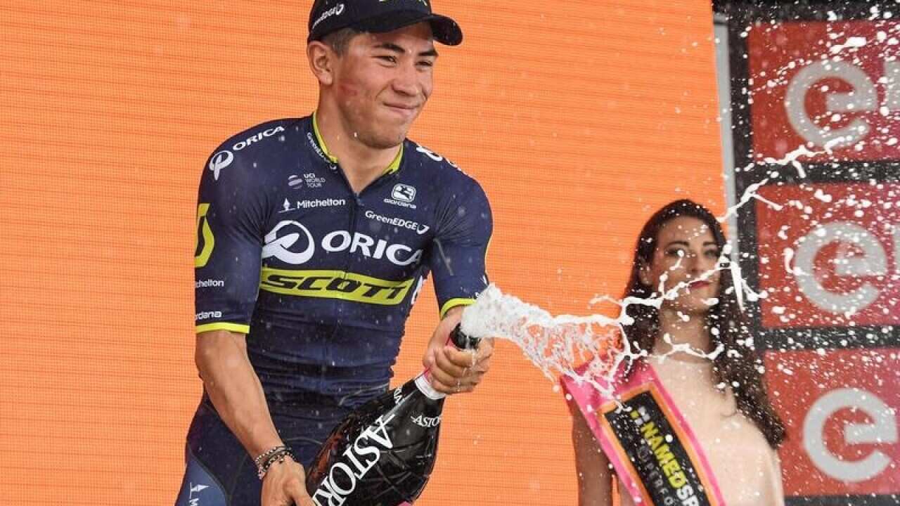 Caleb Ewan celebrates on the podium.