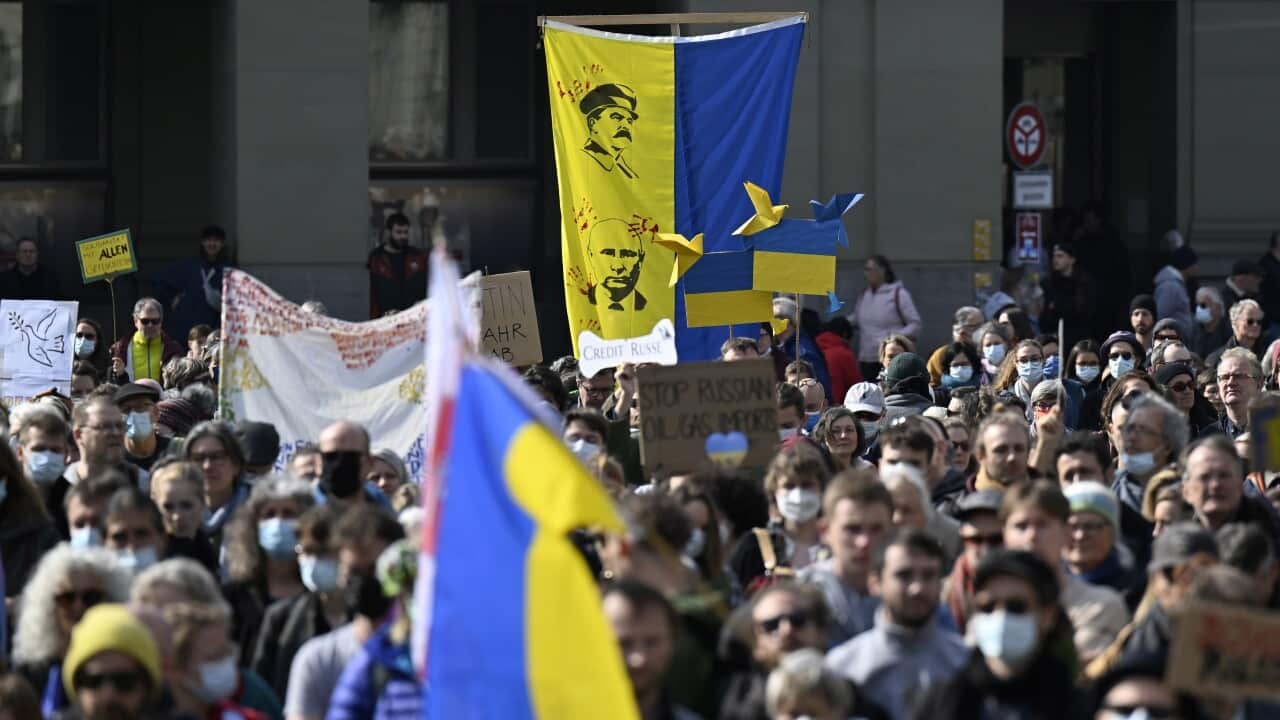 Protesters take part in a demonstration against the Russian invasion of Ukraine in Bern, Switzerland