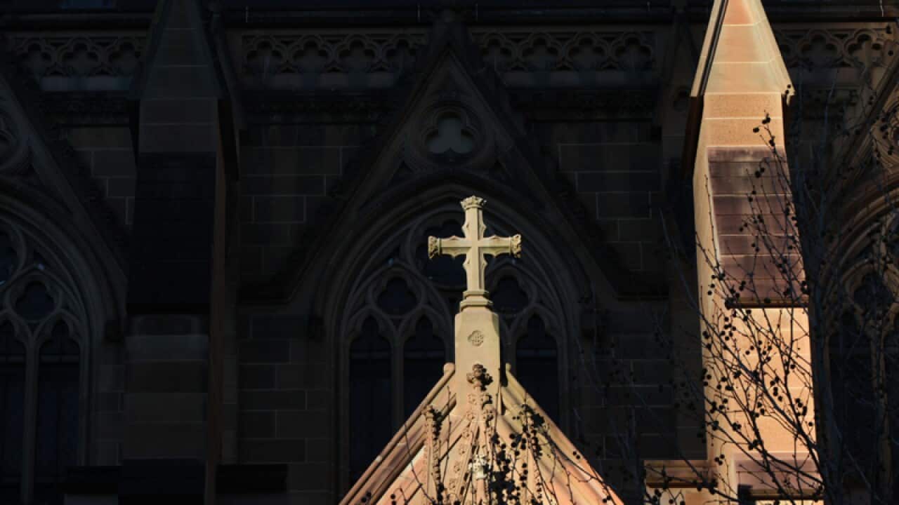 A cross on the exterior of a church