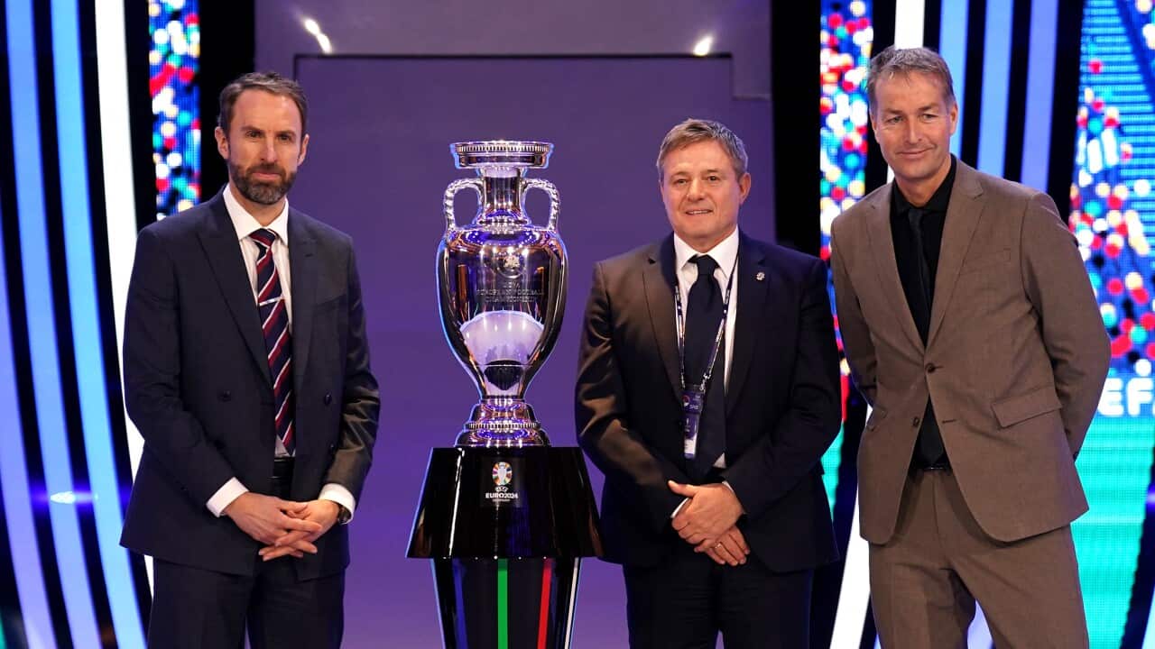 England head coach Gareth Southgate (left), Serbia head coach Dragan Stojkovic and Denmark head coach Kasper Hjulmand pose with the trophy during the Euro 2024 draw in Hamburg
