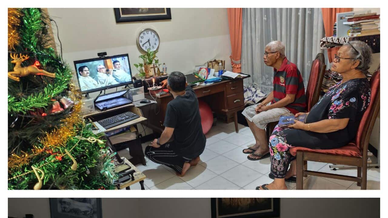 Photo 1: An Indonesian elderly couple waiting for the loudspeaker to be adjusted during the online Christmas Eve mass, 24 Dec 2024. Courtesy: Dr Valentina Utari.
Photo 2: An elderly Indonesian couple listening attentively to the priest delivering his early morning mass, December 2025. Courtesy: Dr Valentina Utari.