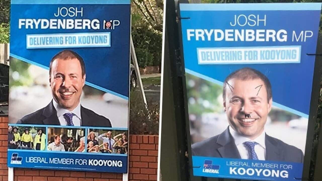 Two of the vandalised posters.