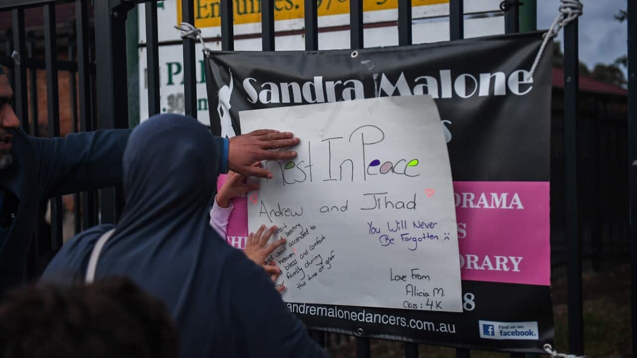 Members of the community attend a vigil outside Banksia Road Public School, Greenacre, Sydney, Tuesday, November 7, 2017.