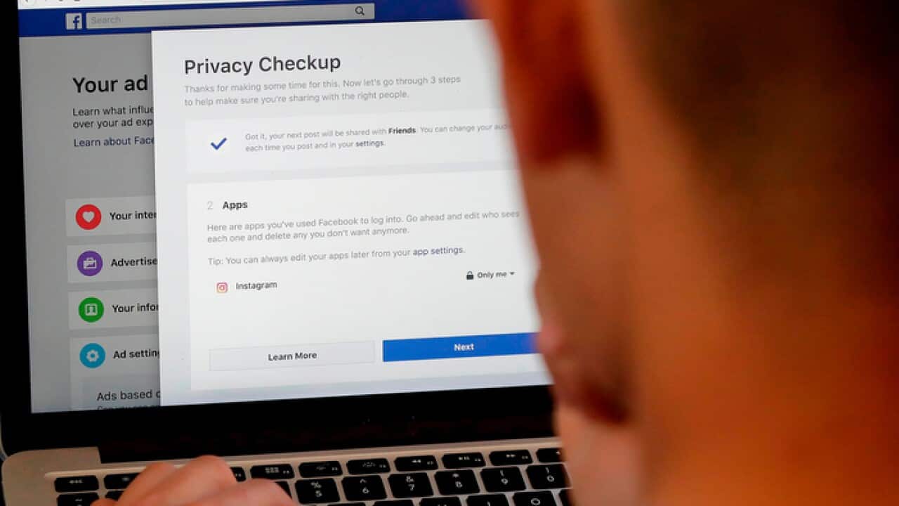 A Facebook user checks out his privacy settings on the popular app