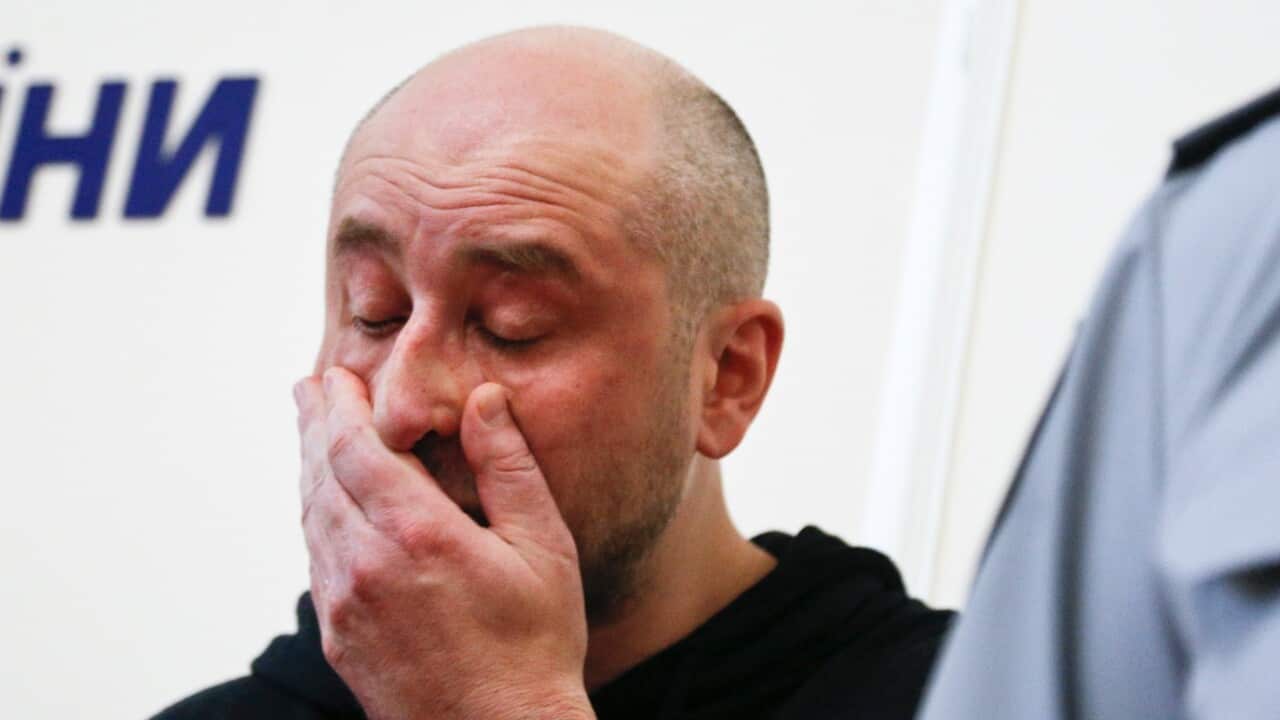 Russian journalist Arkady Babchenko, reacts during a news conference with Vasily Gritsak