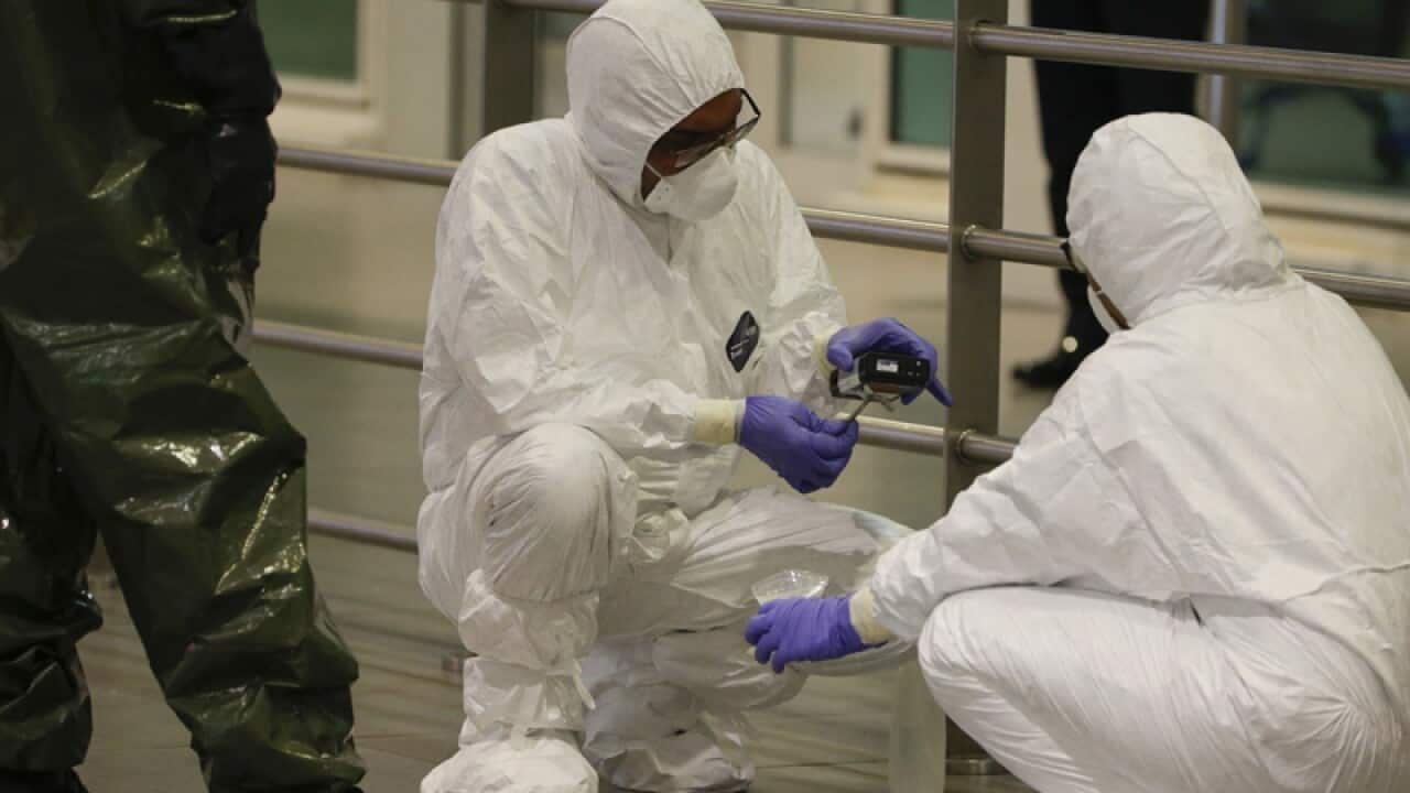 A Hazmat team conducts checks inside Kuala Lumpur Internatinal Airport