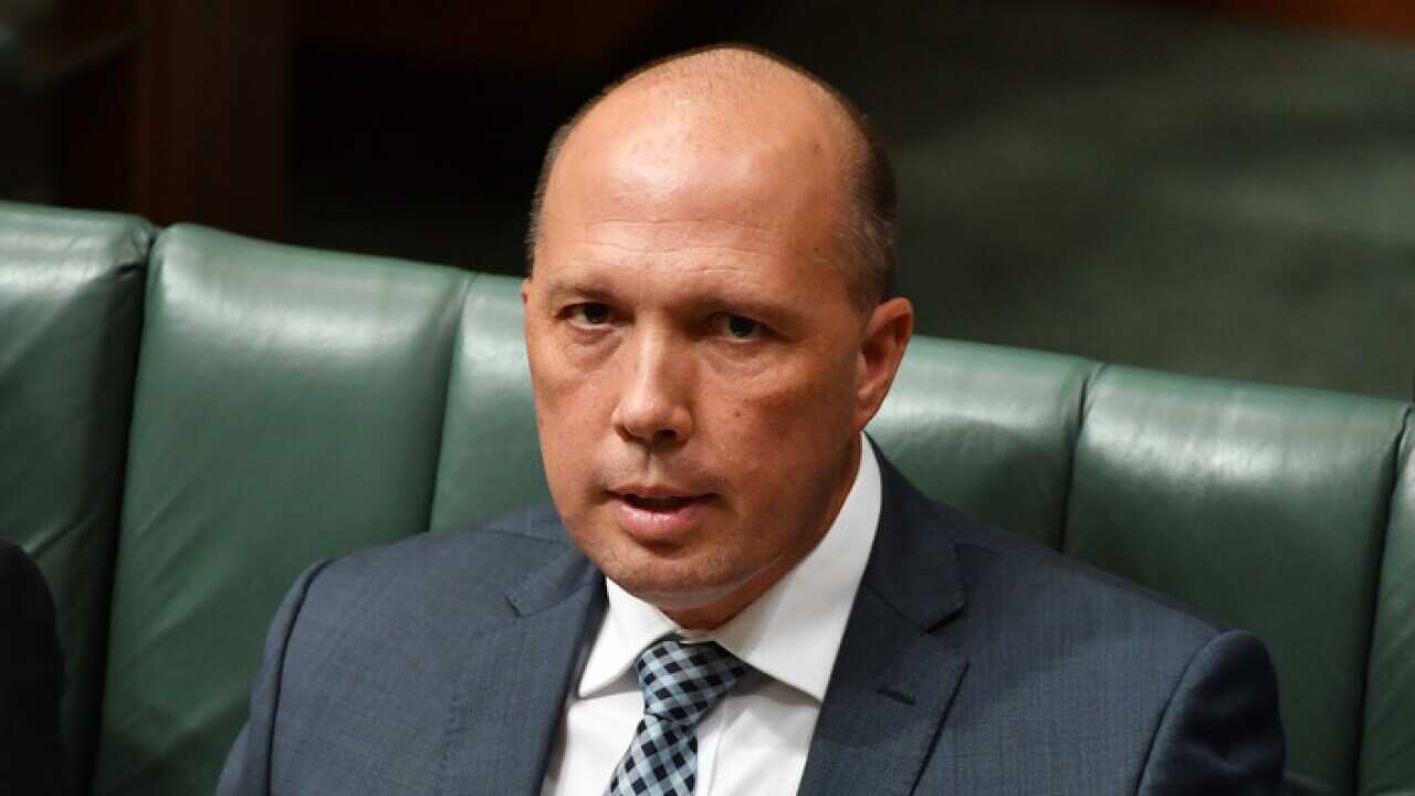 Minister for Immigration Peter Dutton during Question Time in the House of Representatives at Parliament House in Canberra, Monday, Feb. 13, 2017. (AAP Image/Mick Tsikas) NO ARCHIVING
