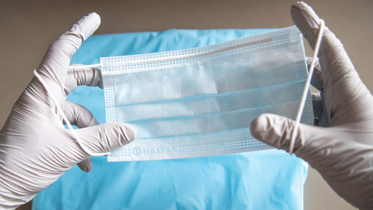 A health care worker holds a surgery mask..Surgery and respirator masks shortage in Australia due to the Covid-19 outbreak. (Photo by Florent Rols / SOPA Images/Sipa USA)