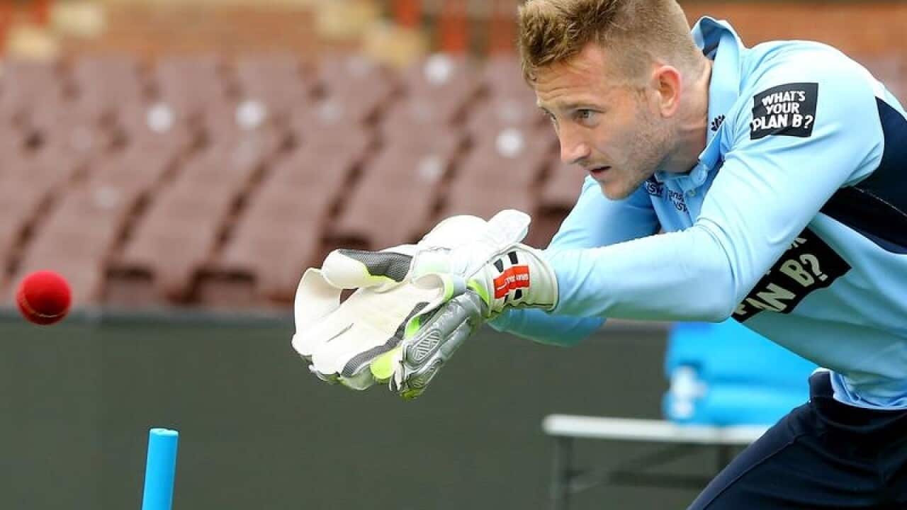 Captain of the Blues, Peter Nevill warms up.