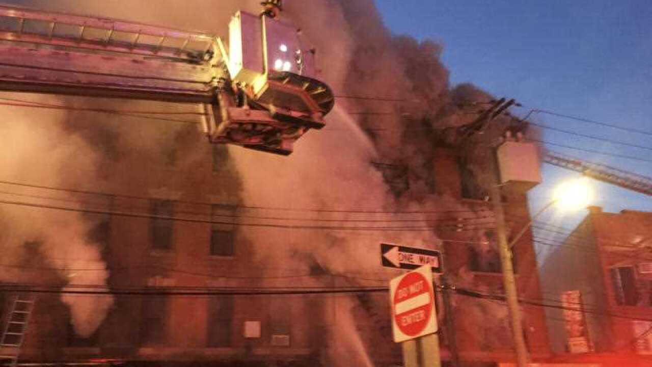 In this photo provided by the FDNY, firefighters battle a blaze at a building in the Bronx borough of New York, Tuesday, Jan. 2, 2018. 
