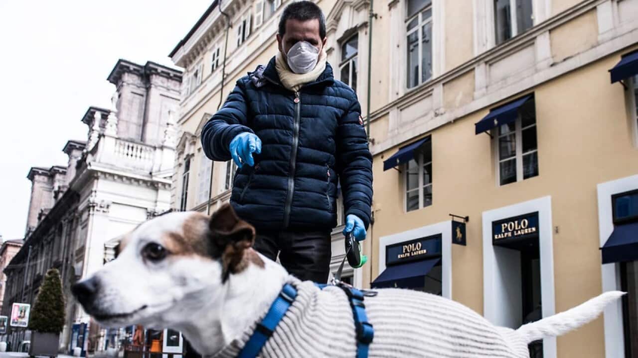 A man and his dog in Turin, Italy, during the coronavirus outbreak
