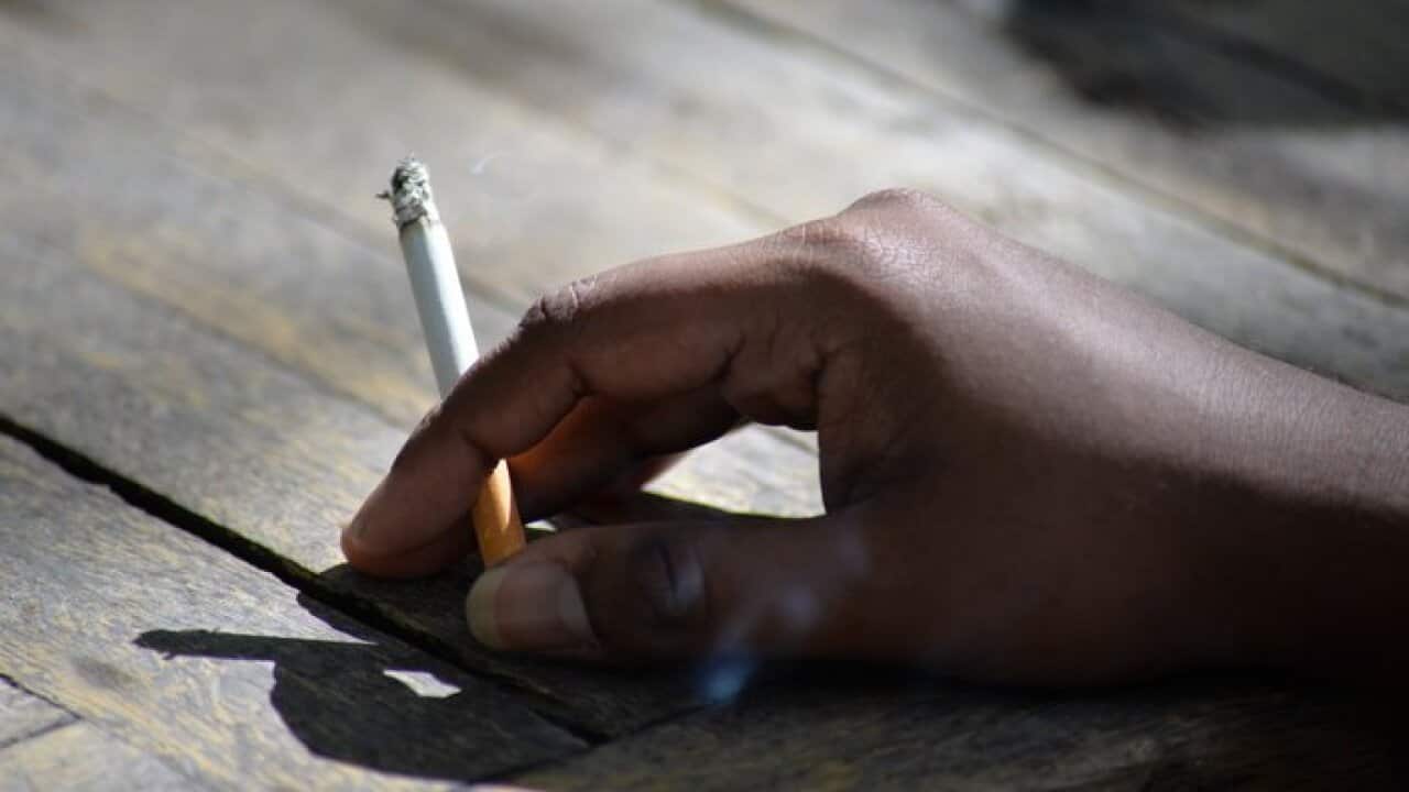 Cropped Image of Hnad Holding Cigarette