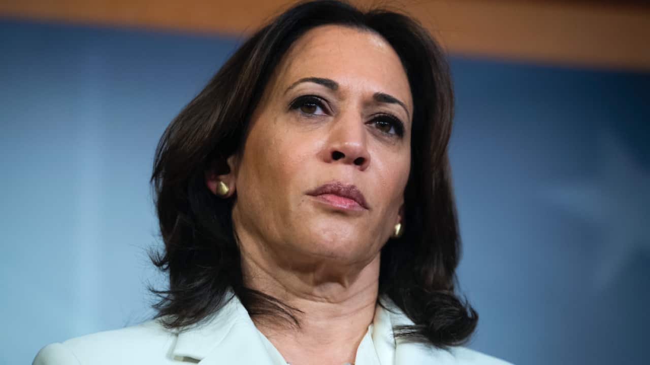 Kamala Harris talks to reporters.