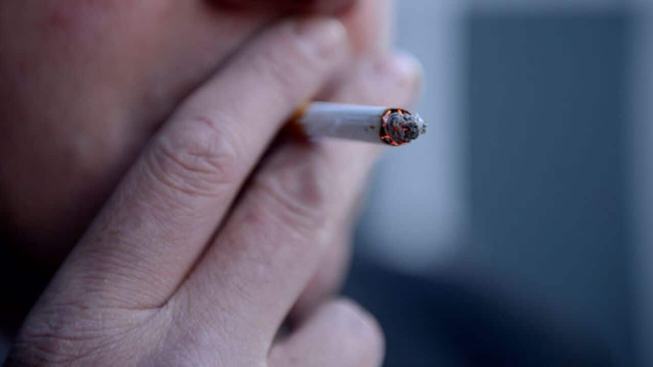 A man smoking a cigarette