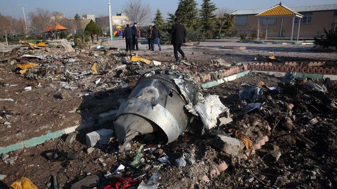 Rescue teams work amidst debris after a Ukrainian plane carrying 176 passengers crashed near Imam Khomeini airport in the Iranian capital Tehran.