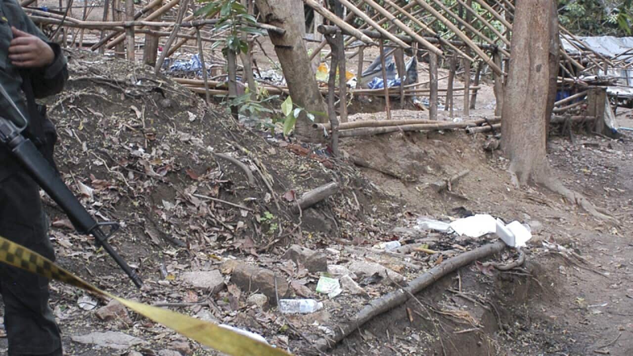A Border Patrol police officer secures the area