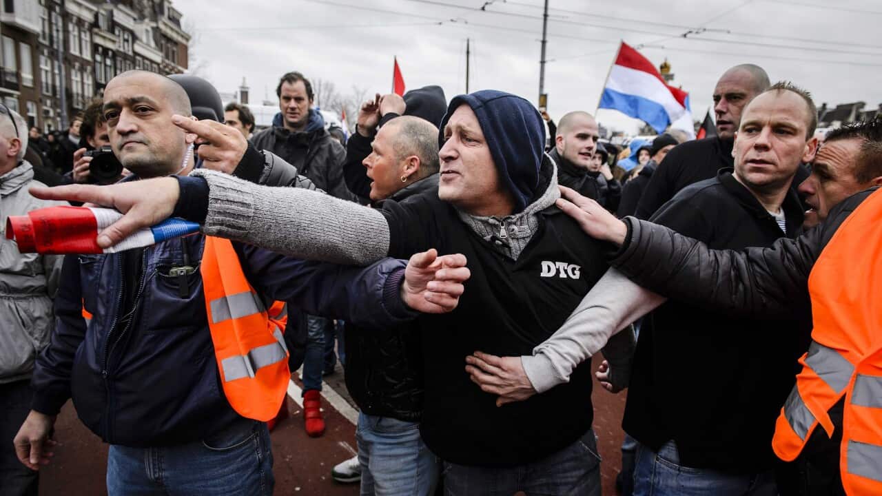 Members of a Dutch branch of the Islamophobic 'Pegida' movement protest during a demonstration in central Amsterdam