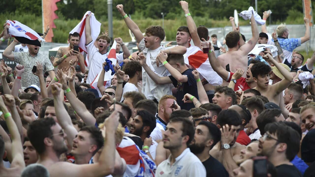 English supporters celebrate at 4TheFans Fan Park, in Manchester, England.