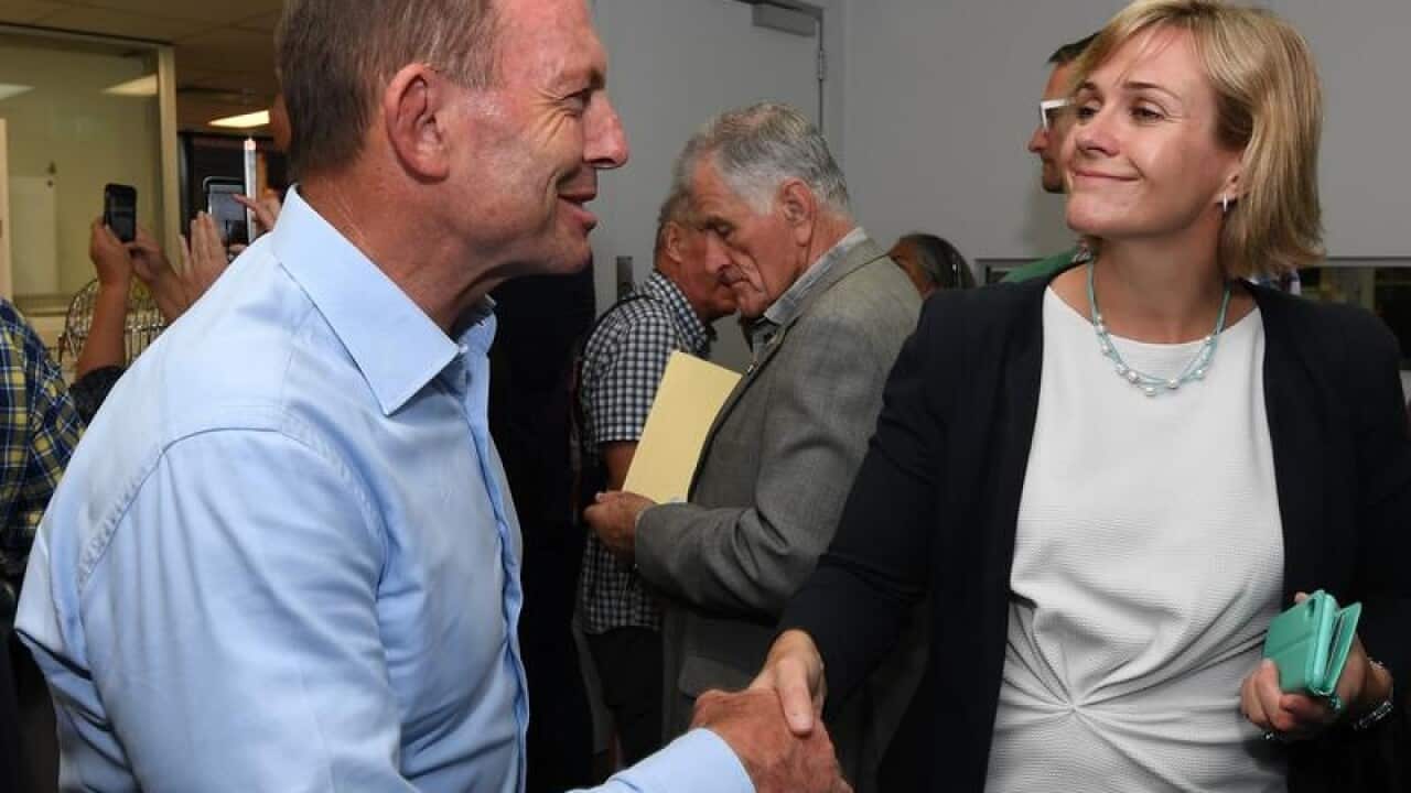 Tony Abbott and Zali Steggall shake hands at the ballot draw.