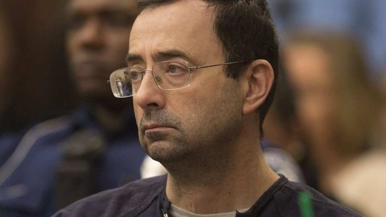 Larry Nassar waits during court proceedings