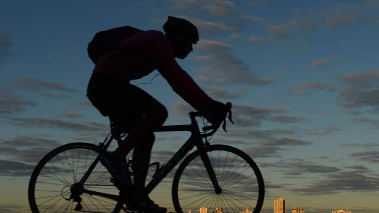 A cyclist rides through Perth.