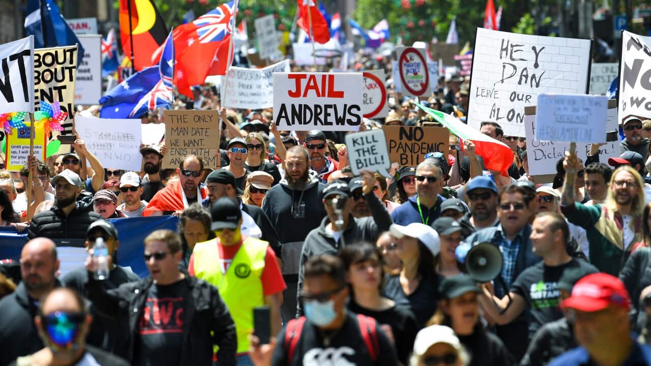 People rally in Melbourne against COVID-19 vaccine mandates and restrictions