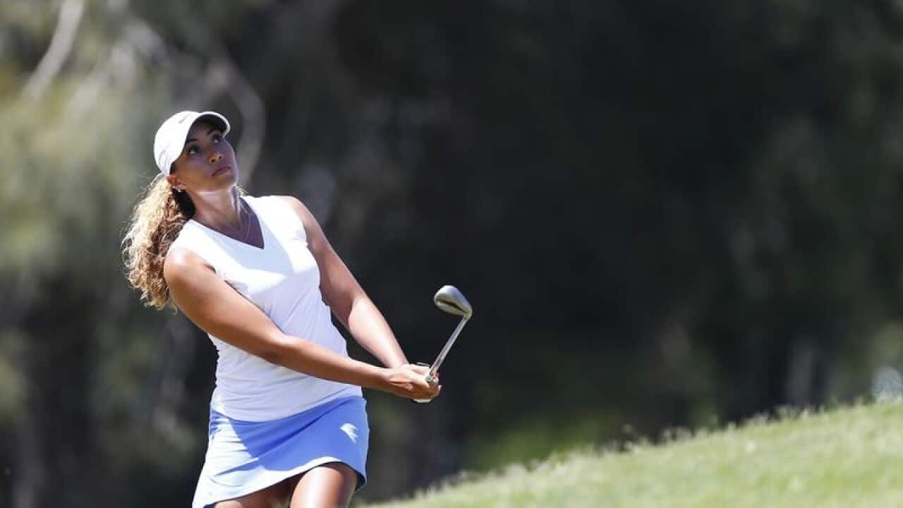 USA's Cheyenne Woods plays a shot