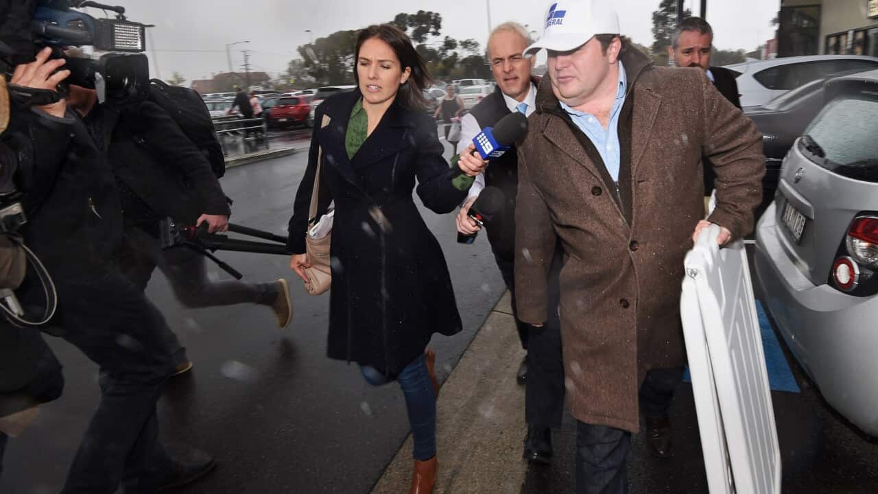 Liberal candidate for McEwen Chris Jermyn runs from the media after boycotting Leader of the Opposition Bill Shorten's visit to Sunbury.