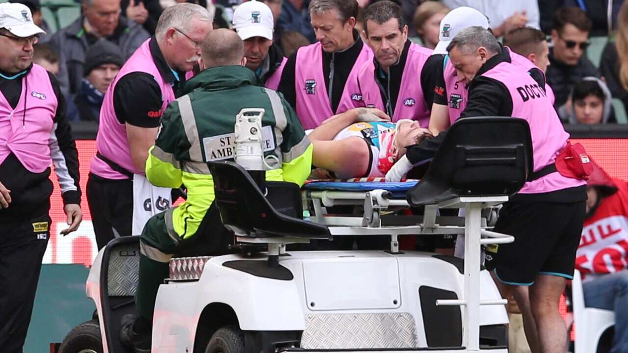 Robbie Gray is taken off the ground injured for Port Adelaide during the Round 12 AFL match between the Carlton and Port Adelaide played at the MCG in Melbourne, Saturday, June 20, 2015. (AAP)
