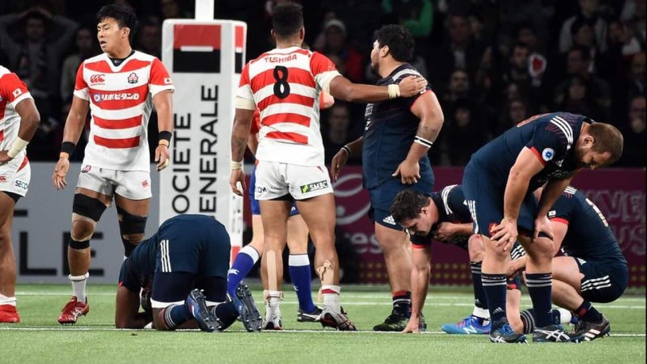 Disappointed French players after the draw with Japan.