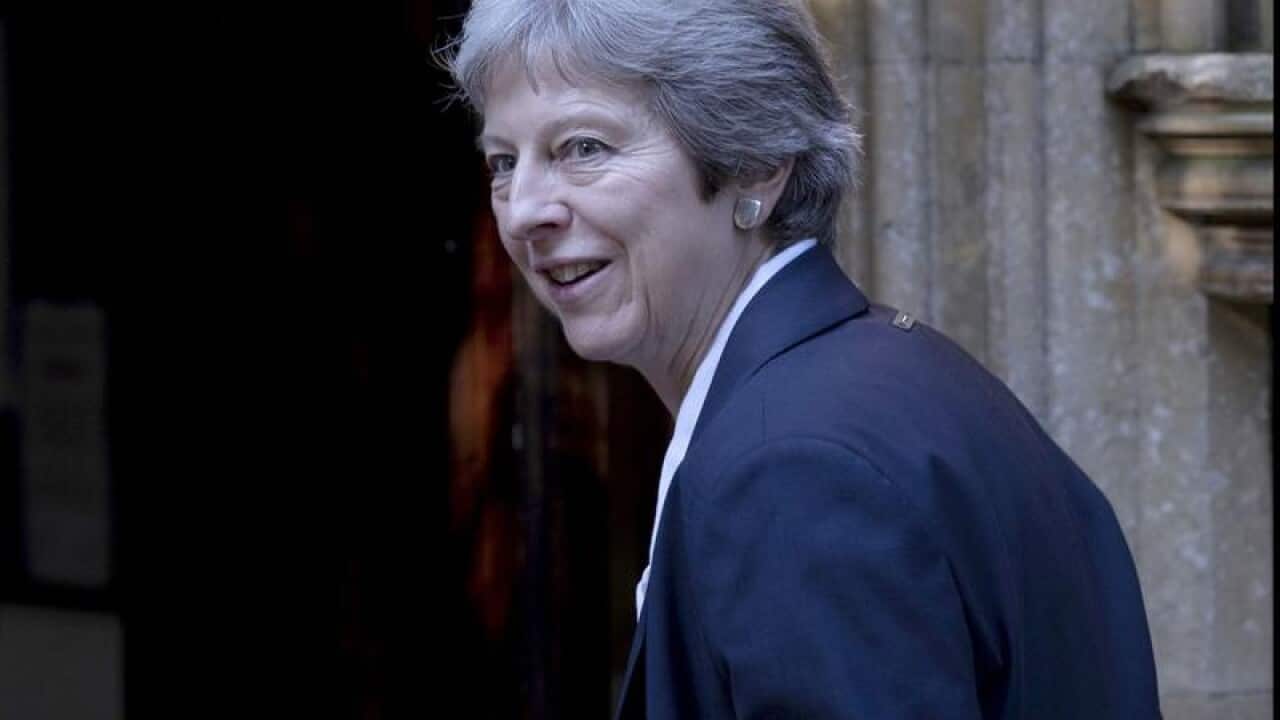 Theresa May attends church near her constituency