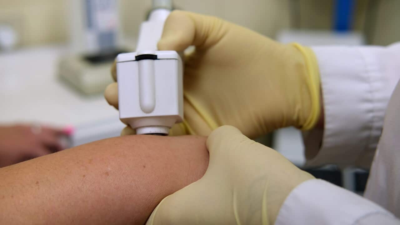 a-dermatologist-examines-the-patients-skin-using-a-dermatoscope-SBI-350654542 (1).jpg