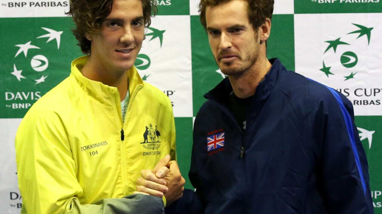Australia's Thanasi Kokkinakis (L) and Britain's Andy Murray
