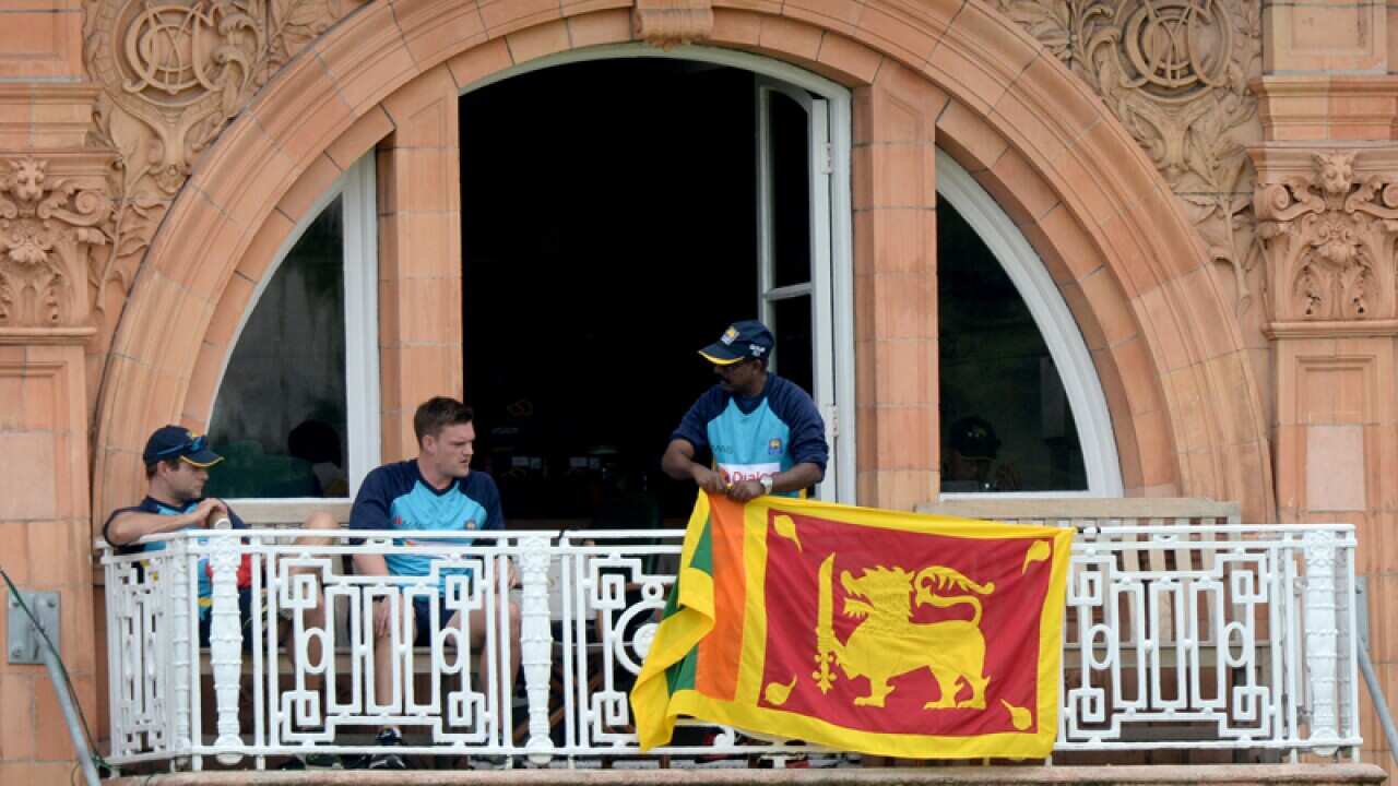 A Sri Lankan flag is displayed in protest during the third Test