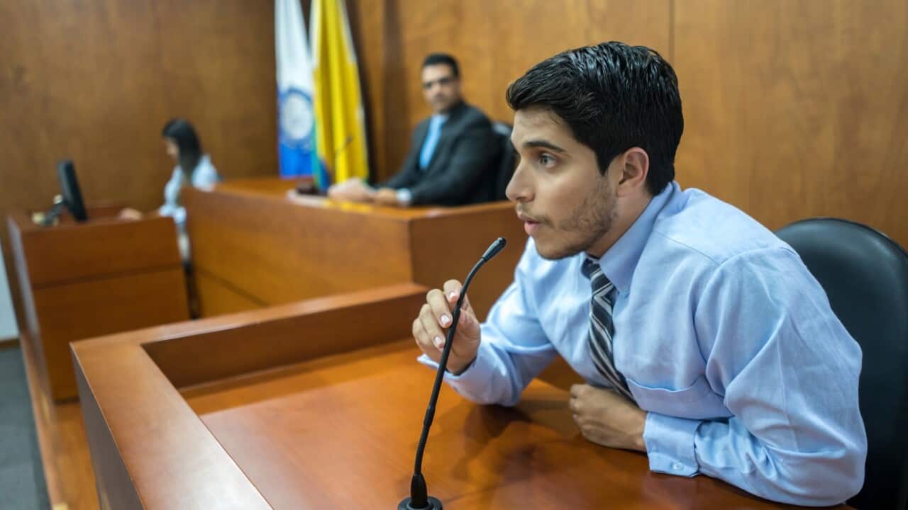 Witness addressing the courtroom in a trial
