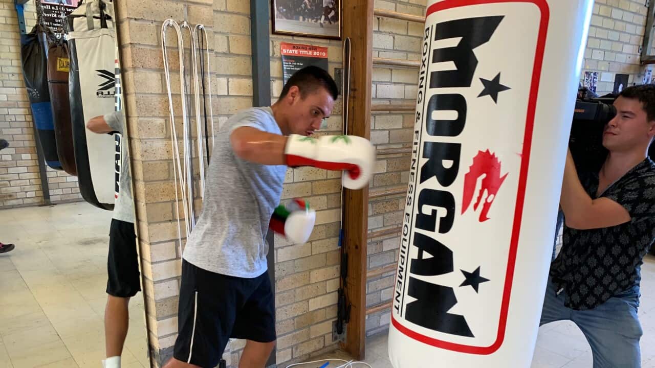 Tim Tszyu hits the bag at training
