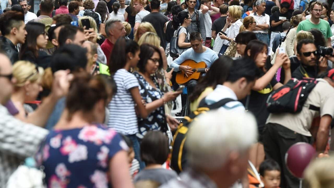 Huge crowds fill Pitt Street Mall and the CBD shopping district as they purchase their last minute christmas gifts on Christmas Eve in Sydney, Wednesday, Dec. 24, 2014. (AAP Image/Dean Lewins) NO ARCHIVING