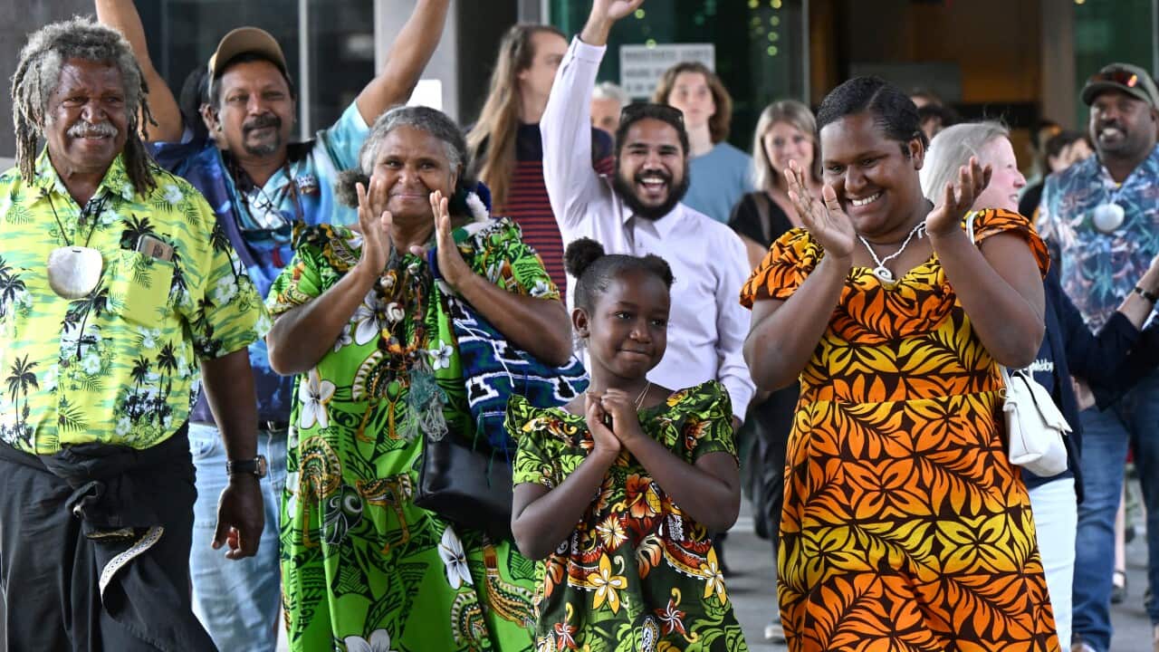 Celebrations outside Brisbane Magistrates Court after the ruling.