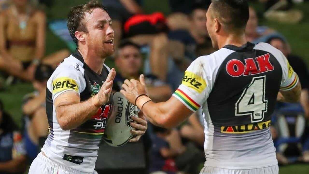 Penrith's James Maloney (L) celebrates after scoring a try