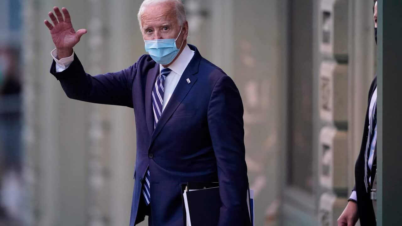 President-elect Joe Biden wavs as he leaves The Queen theater, Tuesday, Nov. 10, 2020, in Wilmington, Del. (AP Photo/Carolyn Kaster)