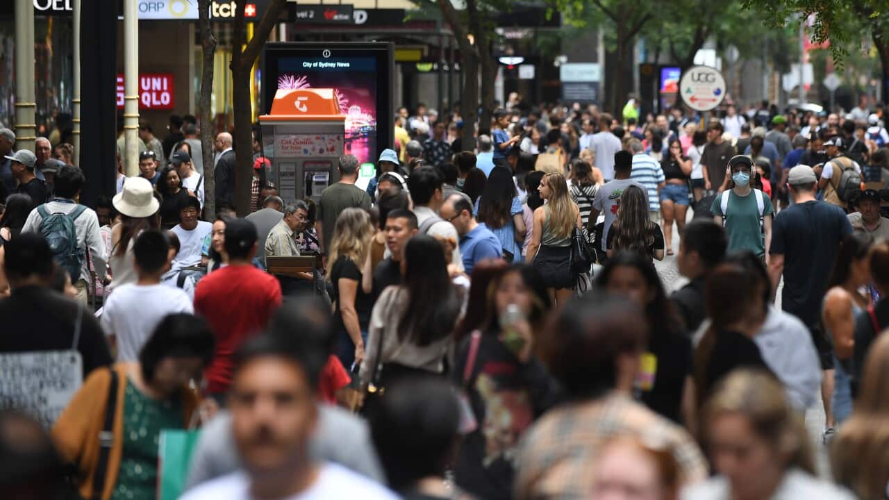 People walk along a street in Sydney