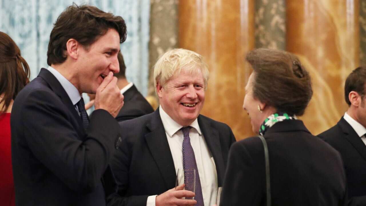 The Princess Royal talks to Canadian Prime Minister Justin Trudeau (left) and Prime Minister Boris Johnson