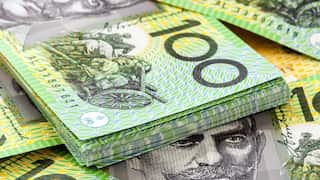 A pile of Australian $100 banknotes