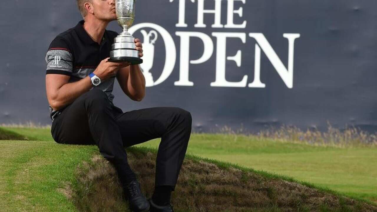 Swedish golfer Henrik Stenson celebrates winning the British Open