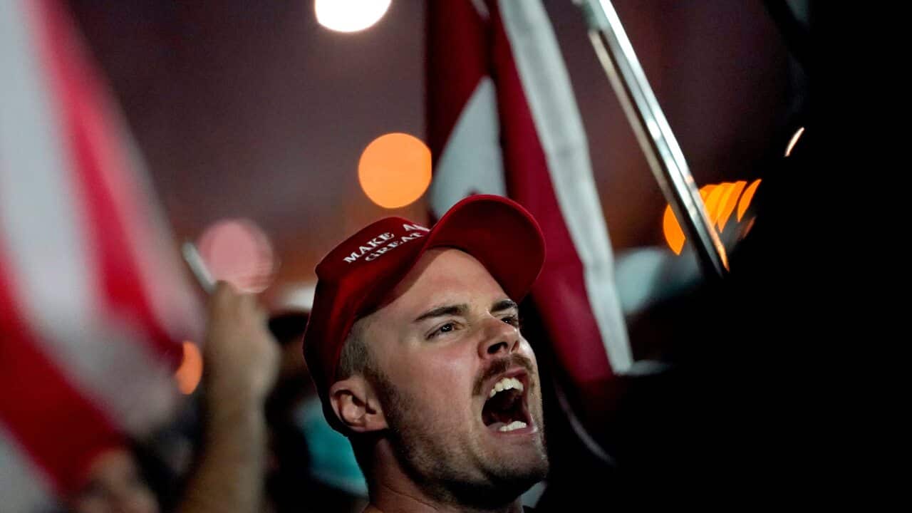 Supporters of President Donald Trump rally in Phoenix.