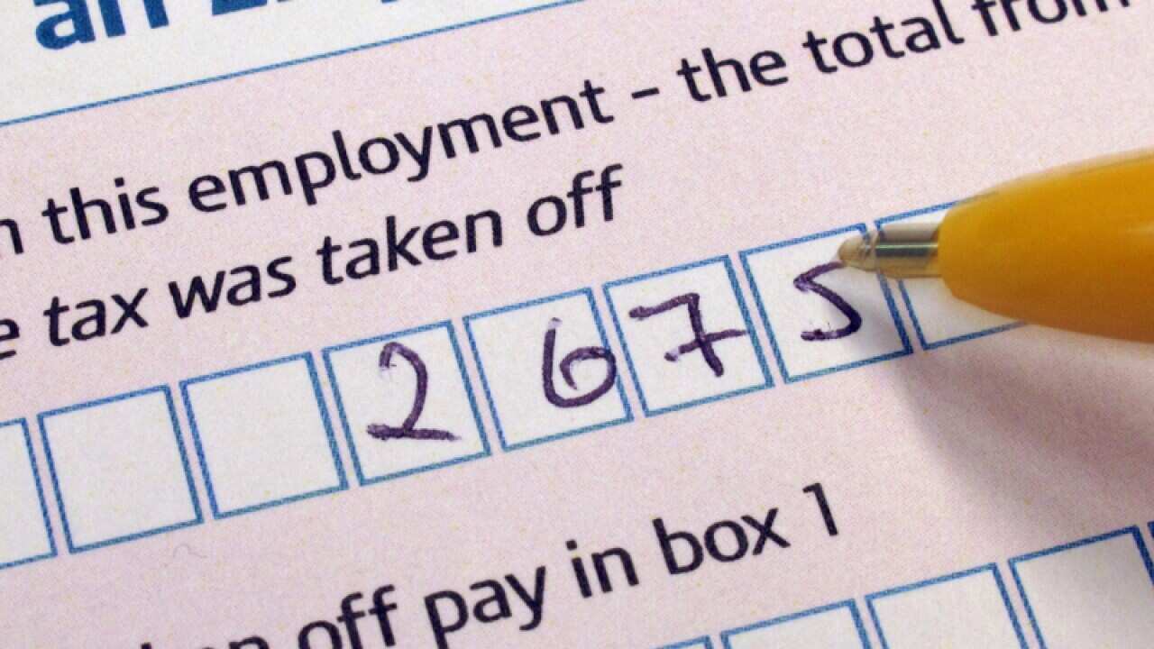 File photo of someone filling in a Tax Return