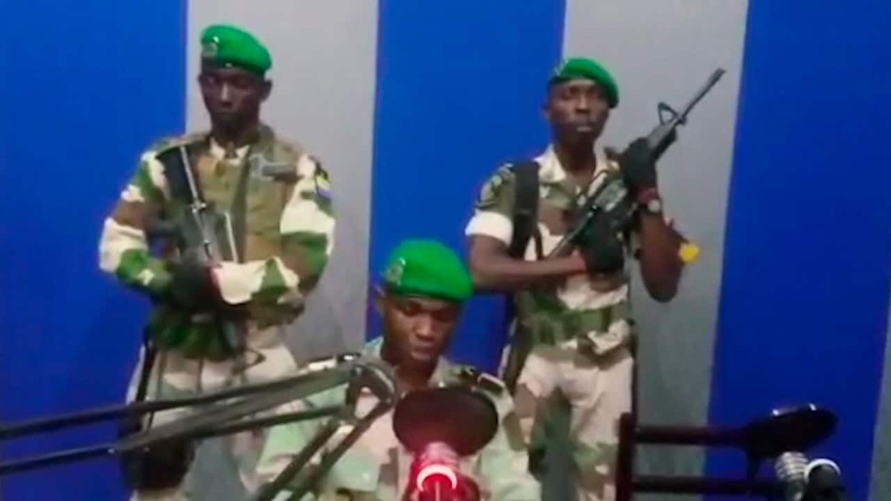 Lt. Obiang Ondo Kelly, commander of the Republican Guard, reads a statement on TV saying the military has seized control of the government.